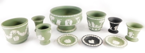 A collection of Wedgwood green Jasperware, items to include vases, bowls, shallow dishes, and two similar black Jasperware pieces. (a quantity)