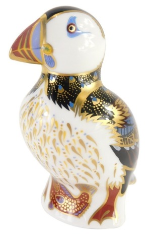 A Royal Crown Derby porcelain puffin paperweight, with silvered stopper and stamped in red to underside, 12cm high.