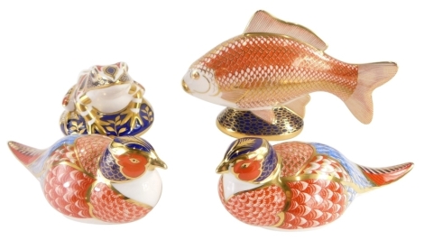 A collection of four Royal Crown Derby porcelain paperweights, two pheasants, frog, and a fish, lacking stoppers. (4)