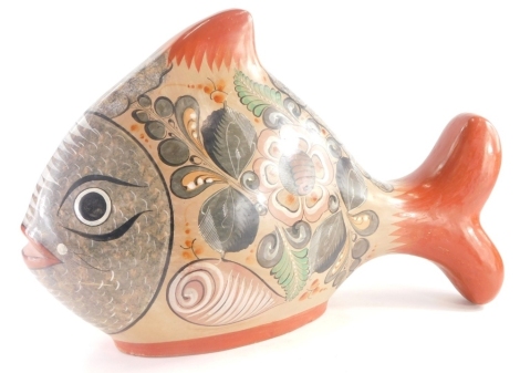 A studio pottery figure of a fish, decorated with flowers, leaves etc., 32cm high.