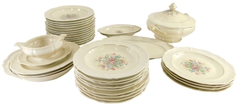 A Royale Limoges part dinner service, printed with wild flowers, on a beige ground with raised decoration in white, the tureen and cover 33cm wide.