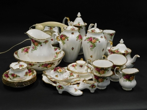 A collection of Royal Albert Old Country Rose pattern wares, to include a pair of jar and covers, 20cm high, wash jug and bowl, coffee pot, teacups and saucers, teapot, etc. (2 trays)