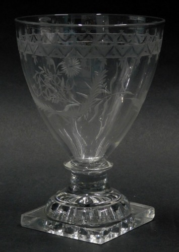 A late 18thC/early 19thC glass rummer, with engraved decoration of leaves, birds surrounding a monogram, with lemon squeezer shaped base, 15cm high.