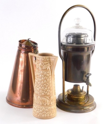 A copper and brass flagon of tapering form in Arts and Crafts style, a coffee percolator with burner, a ewer of tapering form decorated with elephants. (3)