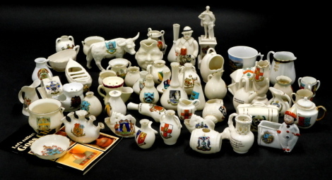 A quantity of crested china, to include some Goss pieces, to include a Horncastle bull, a Carlton China figure titled 'A Yorkshire Man's Advise To His Son', etc.