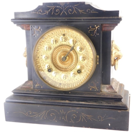 A late 19thC Ansonia mantel clock, in ebonised cast iron base decorated to simulate slate or marble, 28cm high.