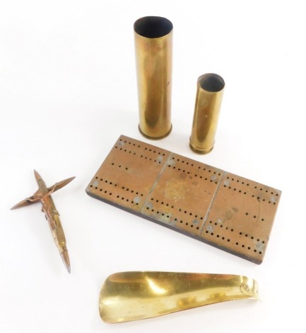 Trench Art. To include two shell cases, a brass shoe horn, possibly made from a shell case, a crucifix figure made from bullet shells, etc. (a quantity)