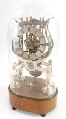 A 19thC brass skeleton clock by Haynes of Stamford, under a glazed dome, on a mahogany and ebony and boxwood cross banded border, terminating in four feet, the clock with a 10cm Roman numeric dial, 35cm high overall.