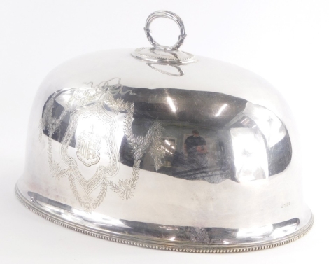 A 19thC silver plated meat cover, by S. Smith & Son King Street, Covent Garden, with an ornate oval handle and engraved crest decoration, the base decorated with a beaded border, 3cm high, 34cm wide.