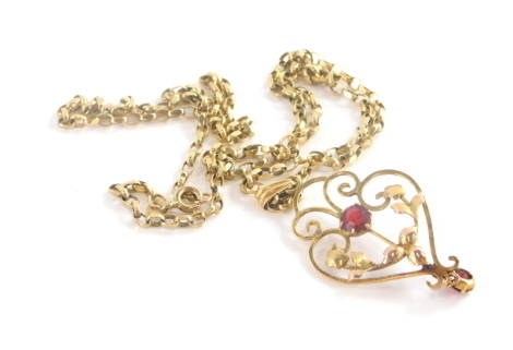 An Art Nouveau pendant and chain, the pendant set with red paste stone, in gold coloured setting on a 9ct gold belcher link chain, the pendant 5cm high the chain 42cm long, 6.5g all in.