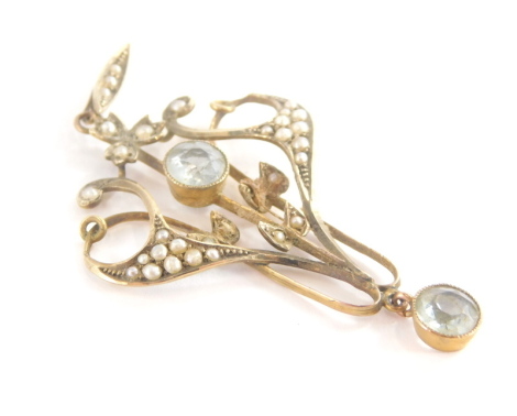 An Art Nouveau pendant, set with seed pearls and aquamarine, in a yellow metal setting marked 9ct, 5cm high, 3.2g all in.