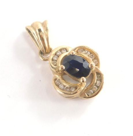 A 9ct gold floral pendant, set with central blue paste stone surrounded by cz stones, on four point floral setting, yellow metal marked 375, 2cm high, 3.7g all in.