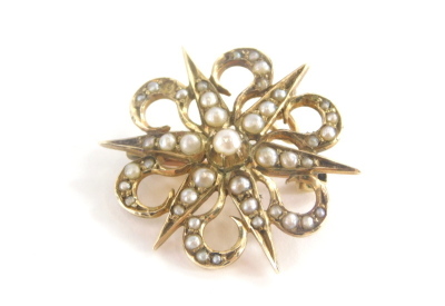 A seed pearl star pendant/brooch, the brooch converted to a pendant with single pendant loop and stick pin back, yellow metal marked 9ct, 2cm wide, 4.2g all in.