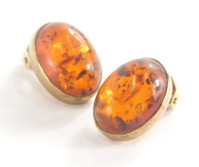 A pair of 9ct gold and imitation amber stud earrings, each with clip on backs, 1.5cm high, 4.5g all in.