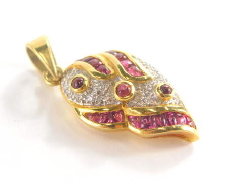 A modern pendant, set with imitation ruby and diamond stones, in a silver gilt setting marked 835, 3cm high.
