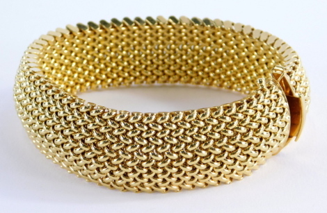 An 18ct gold bracelet, of woven design with sliding clasp and safety claw, 21cm long, 49.4g all in.