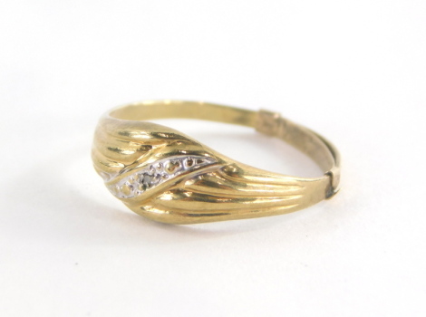 A 9ct gold dress ring, with central twist design set with tiny white stone with additional ring sizer band, ring size M, 0.9g all in.
