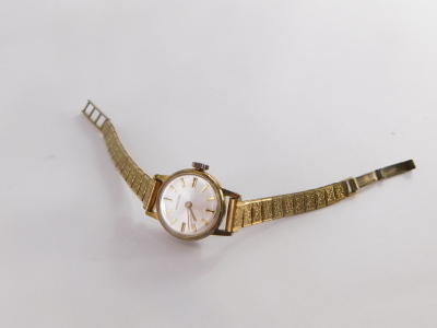 An Ingersol ladies wristwatch, with silvered coloured dial with stainless steel back, on a gold plated strap. - 2