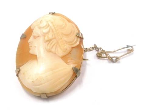 A carved shell cameo, in yellow metal mount, stamped PG.