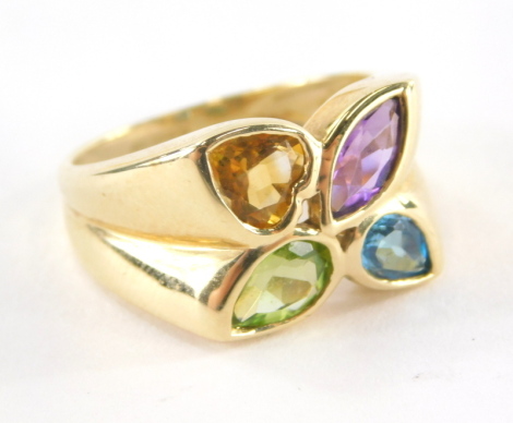 A 14ct gold dress ring, of three point design with tear drop cut blue and green stones, a diamond shaped amethyst stone and a heart shaped citrine stone, each in a rub over setting, the band marked QVC, ring size P, 5.8g all in.