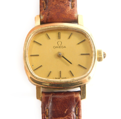 An Omega gold plated gentleman's wristwatch, with oval design watch head, 1.8cm wide on a later tanned leather strap.