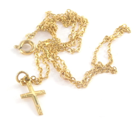 A 9ct gold crucifix pendant and chain, the small pendant on a fine link neck chain, approximately 40cm long, 1.2g all in.