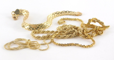 Four various silver gilt necklaces and bracelets, to include a gold coloured weaved designed bracelet marked 925 Italy, 19cm long, a fancy link chain, 42cm long, a multi-link fancy link chain, 44cm long and a rope twist chain, 40cm long, all marked 925 It