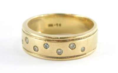 A 9ct gold half hoop eternity ring, with tension set tiny diamonds totalling approx 0.15ct, ring size P½, 5.1g all in.