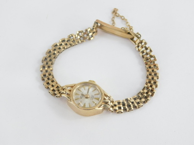 A Rotary 9ct gold ladies wristwatch, with small silver coloured circular dial, 1.2cm wide, on a three row 9ct gold bracelet, with safety chain, 14.1g all in, boxed. - 2