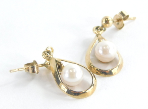 A pair of 9ct gold drop earrings, each drop with tear drop loop with central pearl lustre bead, on butterfly backs the earrings 2cm drop, 1.6g all in.