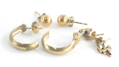 A group of 9ct gold and other earrings, to include a pair of 9ct gold ball studs with butterfly backs, a pair of 9ct gold etched design hoops and a pair of bi-colour 9ct gold drop earrings, three pairs, 2.7g all in.