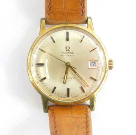 An Omega Geneve automatic gentleman's wristwatch, in a gold plated and stainless steel case, with inscription 'in appreciation for long service for D. Newbold 1971', on a tan leather strap, boxed.