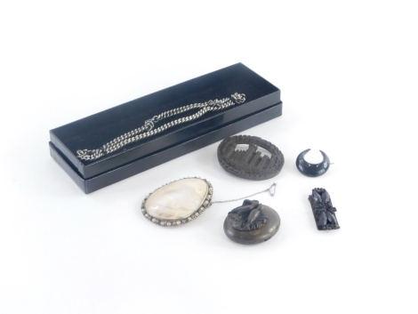 A group of costume jewellery, to include a carved malachite oval brooch lacking back pin, a Victorian style memorial pendant, with grouse and reed detailing, a mother of pearl brooch, silver plated chain, loose jet, etc. (a quantity)