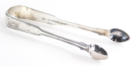 A pair of George III silver sugar nips, with line decoration, London 1808, 1½oz, 14cm long.