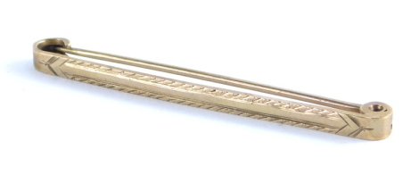 A 9ct gold tie pin, of plain form with plain pin back, 5cm wide, 2.3g.