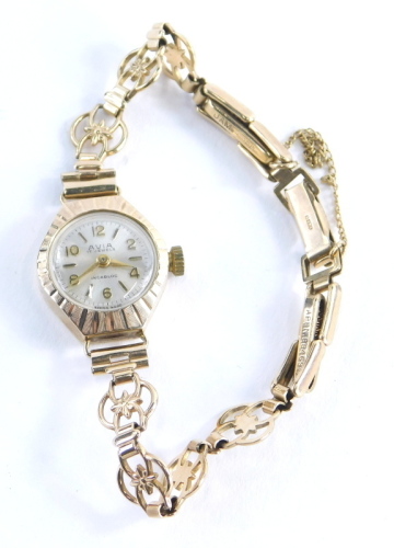 A 9ct gold Avia ladies wristwatch, with fan watch head and bezel, and a similar design bracelet, with additional links, approx 14cm long overall, 11.6g all in, boxed.