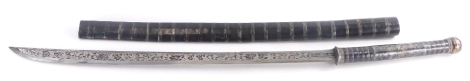 A Burmese silver mounted long sword Dha, with blackened scabbard and handle, the handle also engraved with figures etc., the engraved blade similarly decorated and with inscription, 91cm long.