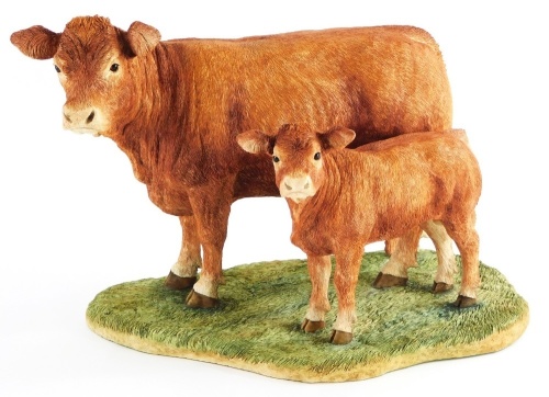 A Border Fine Arts figure group of Limousin cow and calf, BO657, signed Jack Crewdson, number 723/750, on a hardwood base, 29cm long.