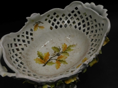 A late 19thC Sitzendorf two handled pedestal bowl, the bowl with pierced decoration, and decorated with leaves, acorns, etc., the base decorated with birds, leaves, acorns, etc. 28cm high. - 2