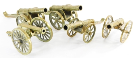 A collection of five brass table cannons, one formed as a match strike. (5)