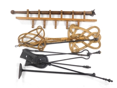 A harlequin iron companion set, to include coal tongs, 59cm high, shovel with shaped pierced end, various other treen, hanging pegs, carpet beaters, etc., (a quantity).