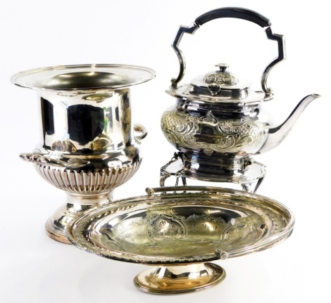 A collection of silver plate, to include a spirit kettle and stand on cabriole legs, a campana urn shaped two handled wine cooler, and an oval silver plated cake basket with loop handle.