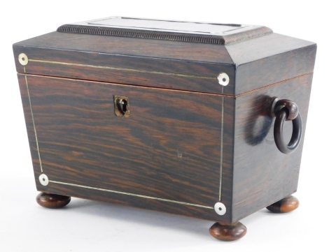 An early Victorian rosewood pewter strung and mother of pearl inlaid sarcophagus shaped tea caddy, the hinged lid enclosing two lidded divisions, flanked by loop handles, (AF), 22cm wide.