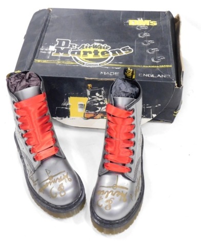 A pair of silver Dr Martens air cushion sole boots, signed by various musicians to include Herbie Hancock.