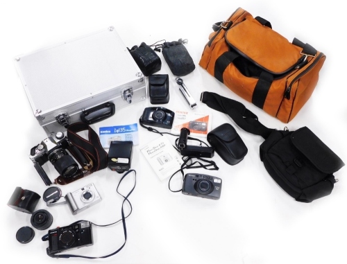 A collection of camera equipment, to include an Olympus OM20 with lens, etc.