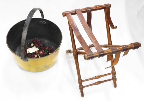 A brass and iron preserve pan, 34cm wide, and a small turned wooden stand.