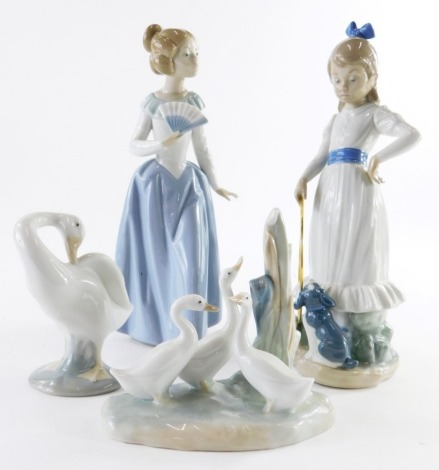 A Lladro goose, and two Nao figurines, and a Nao goose group.