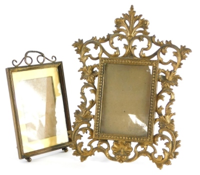 A 19thC gilt cast metal photograph frame, in rococo style, 32cm high, and a small Edwardian photograph frame with shaped crest and beaded border, 22cm high overall. (2)