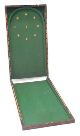 A late 19th/ early 20thC mahogany bagatelle game, with inlaid scorers to the sides, (AF), 91cm high, 51cm wide.