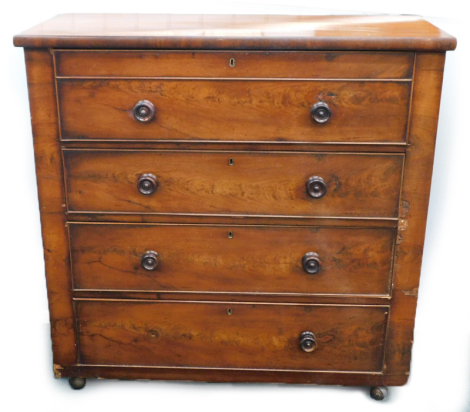 A Victorian figured mahogany chest of four drawers, each with turned wood handles, later castors, 109cm wide.